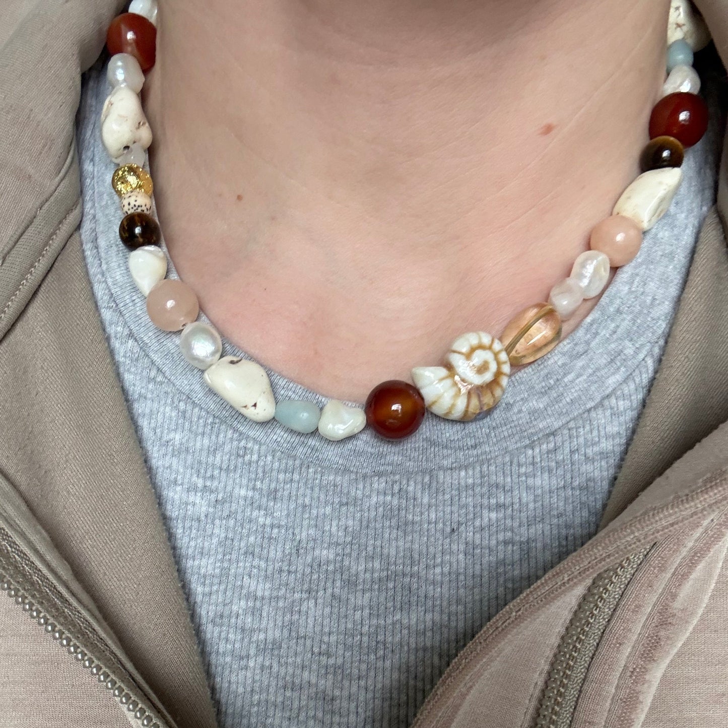 Close-up of a beaded necklace with a neutral background