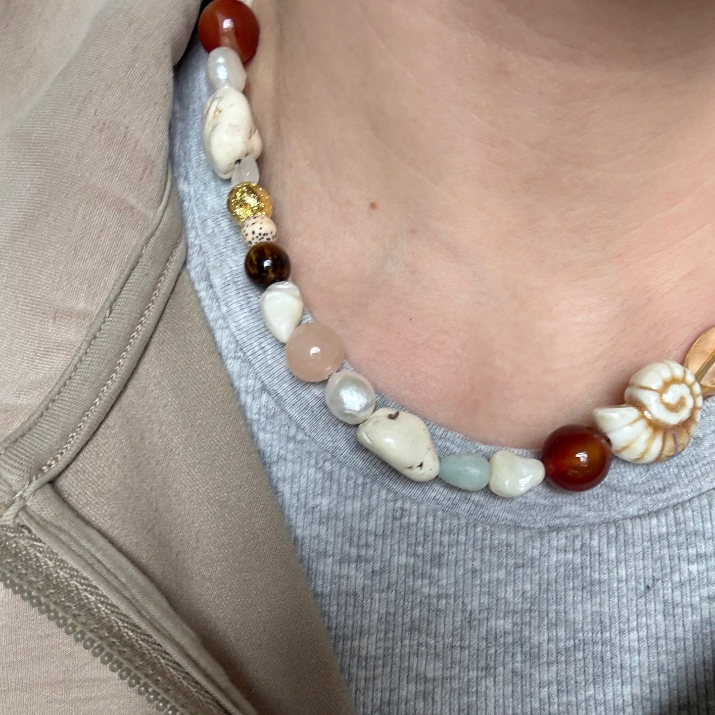 Close-up of a necklace with various beads.