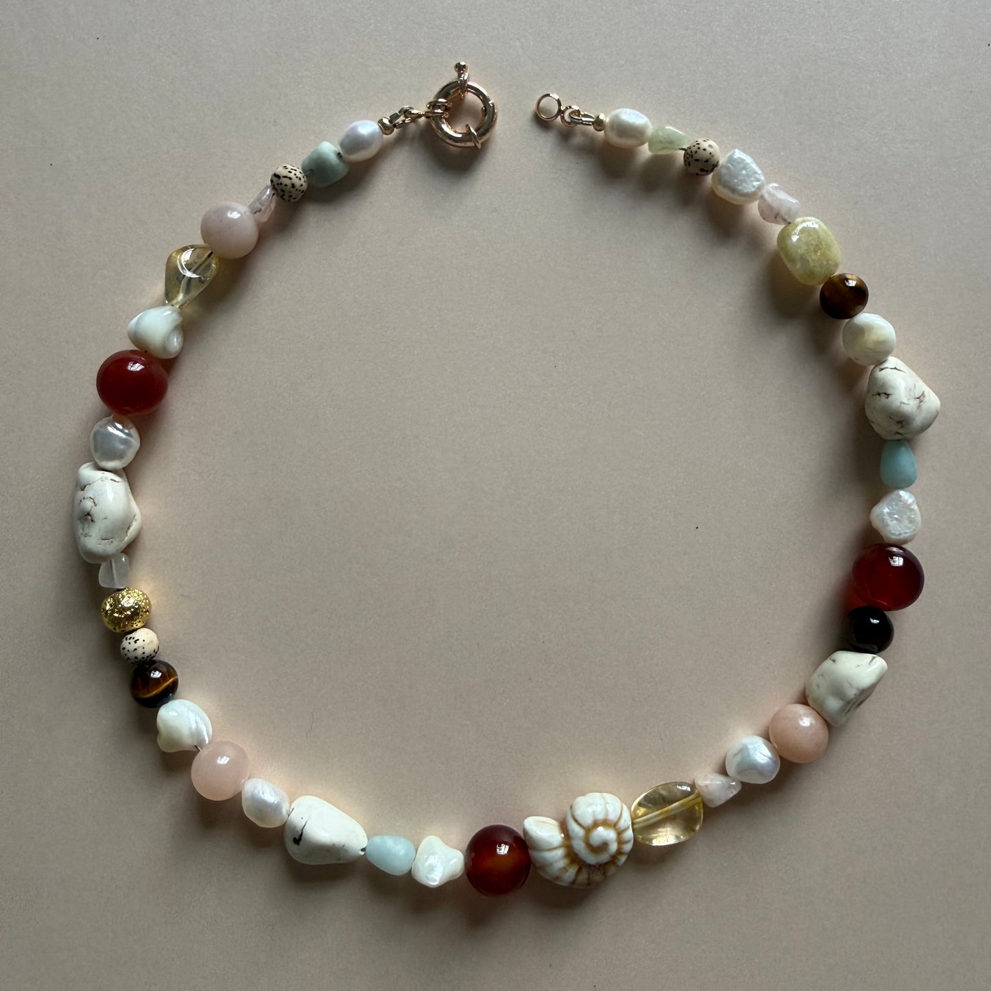 Multicolored beaded bracelet on a beige background