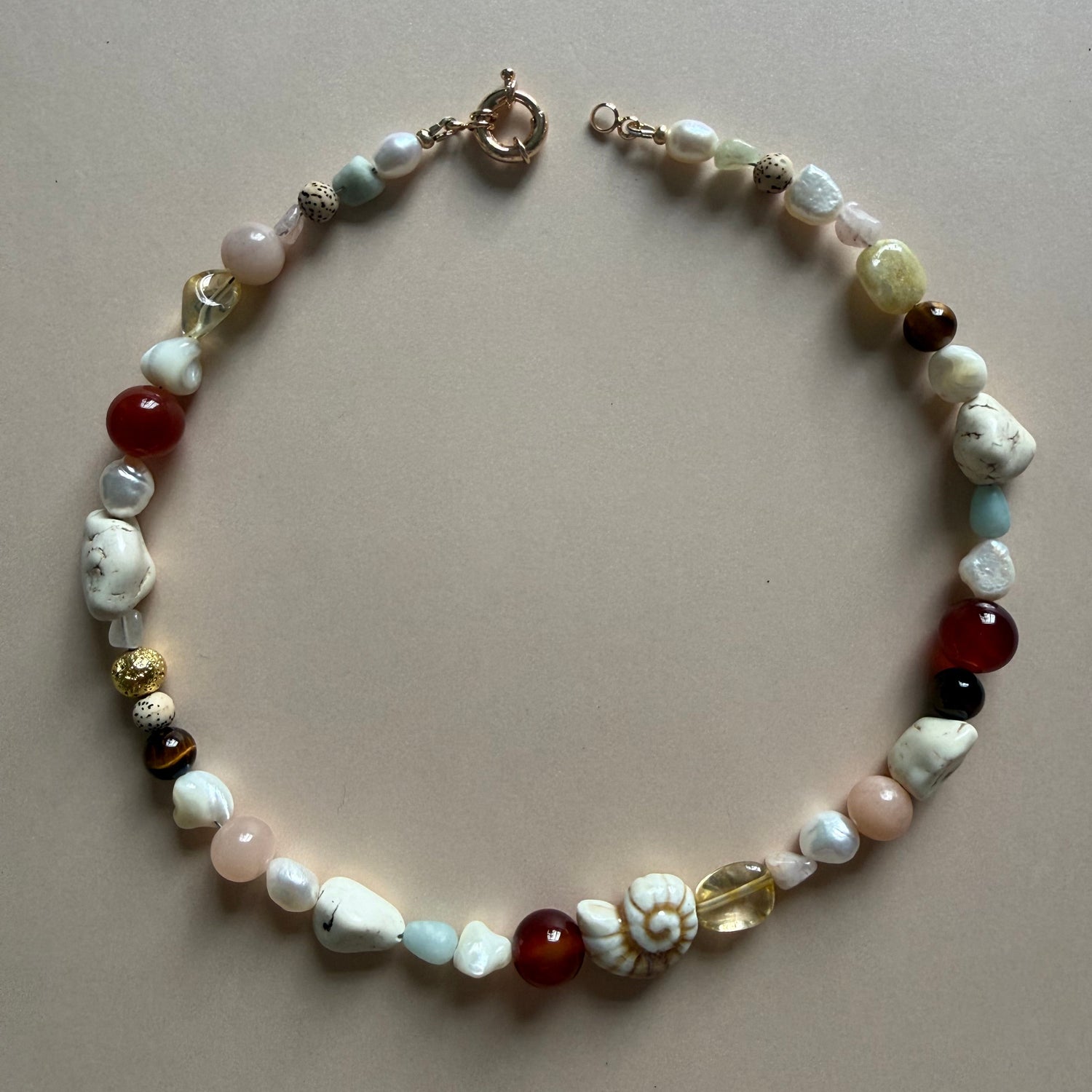 Multicolored beaded bracelet on a beige background