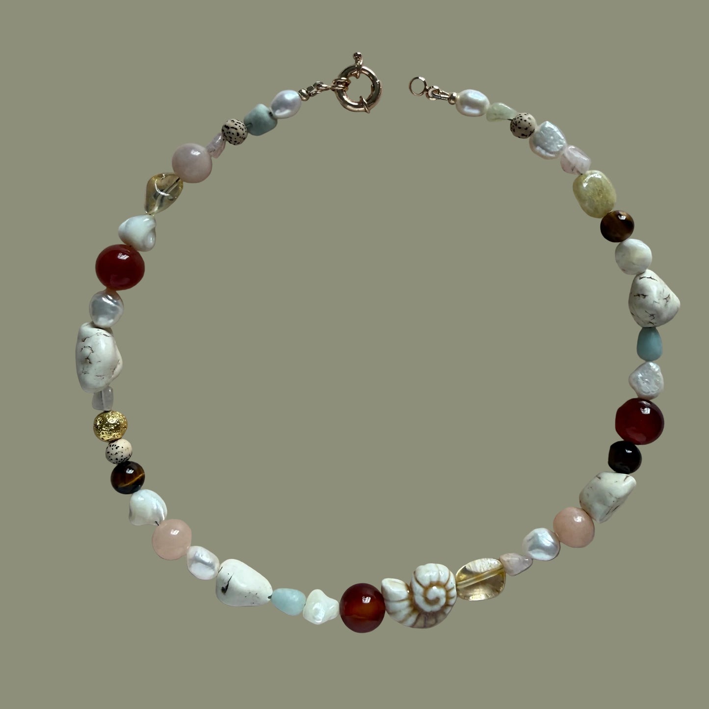 Beaded bracelet with various colored beads on a beige background
