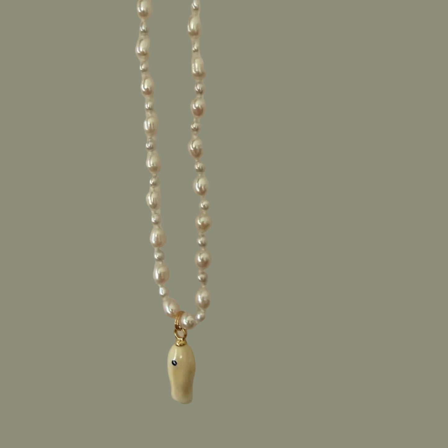 Silver chain with a clasp on a light gray background