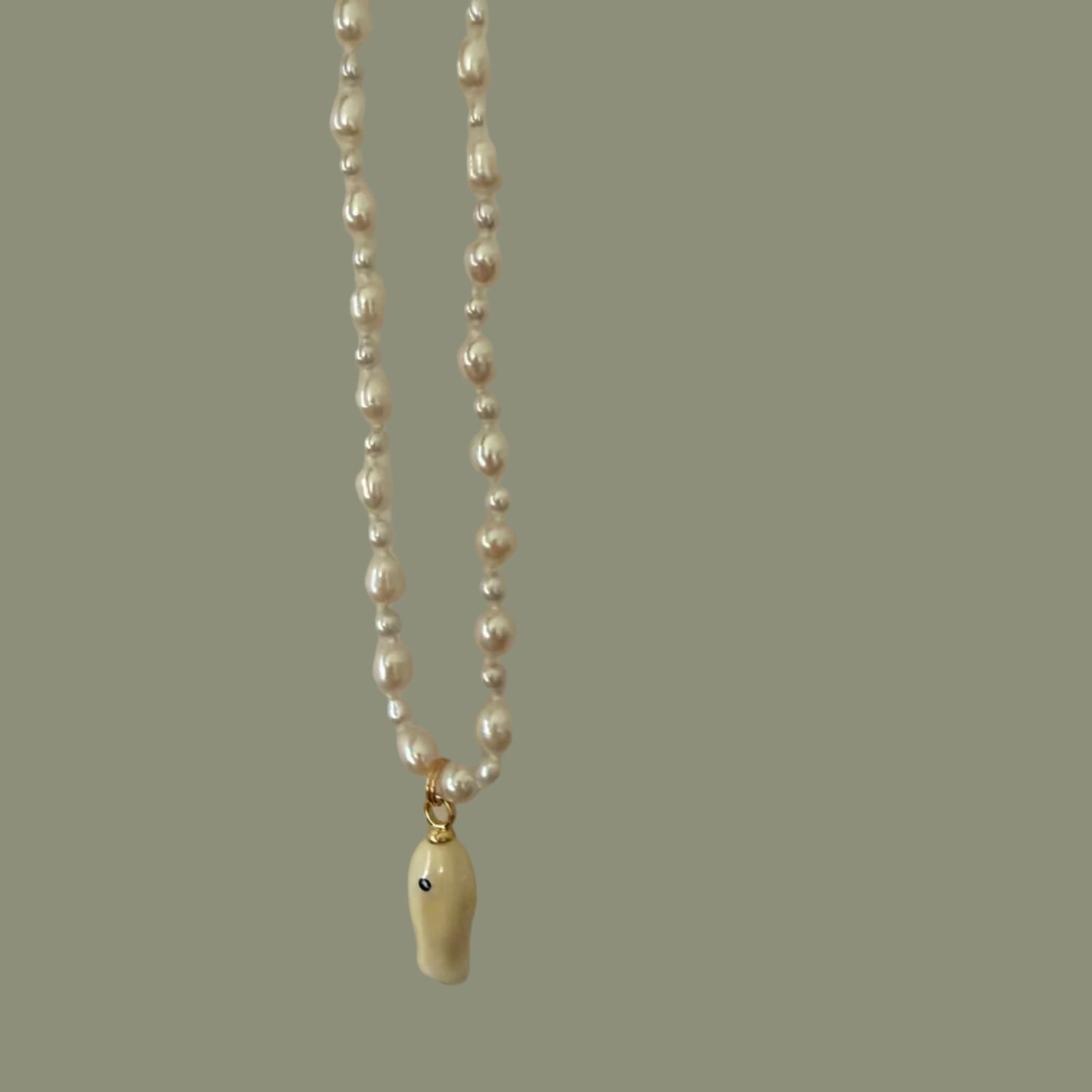Silver chain with a clasp on a light gray background