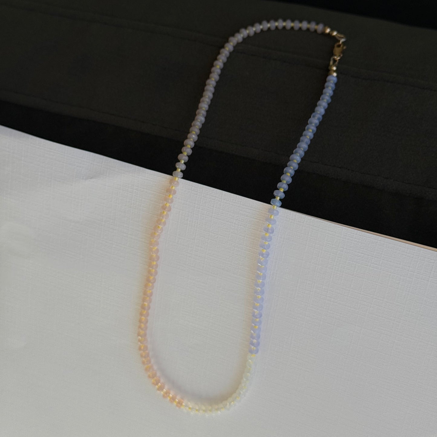 Beaded eyeglass chain on a black and white background