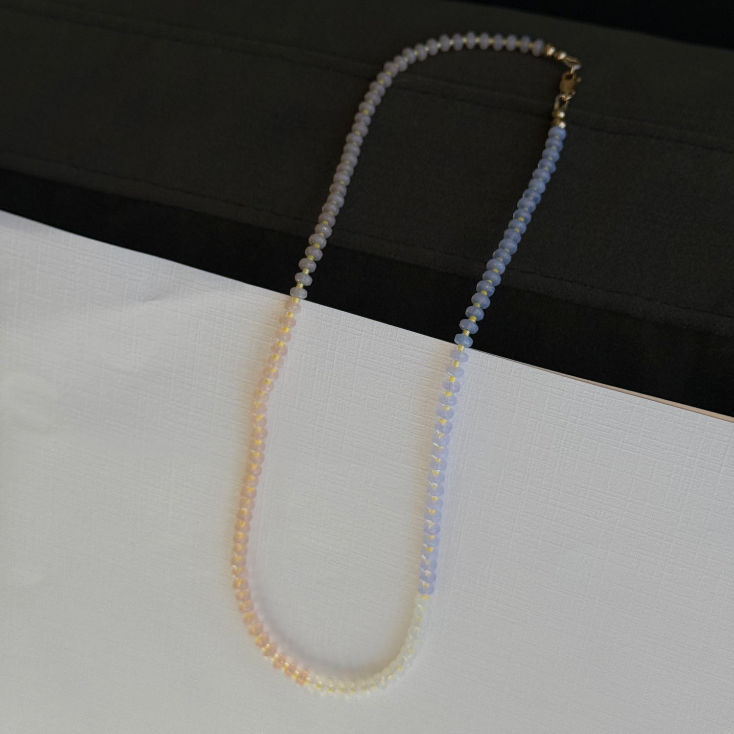 Beaded eyeglass chain on a black and white background