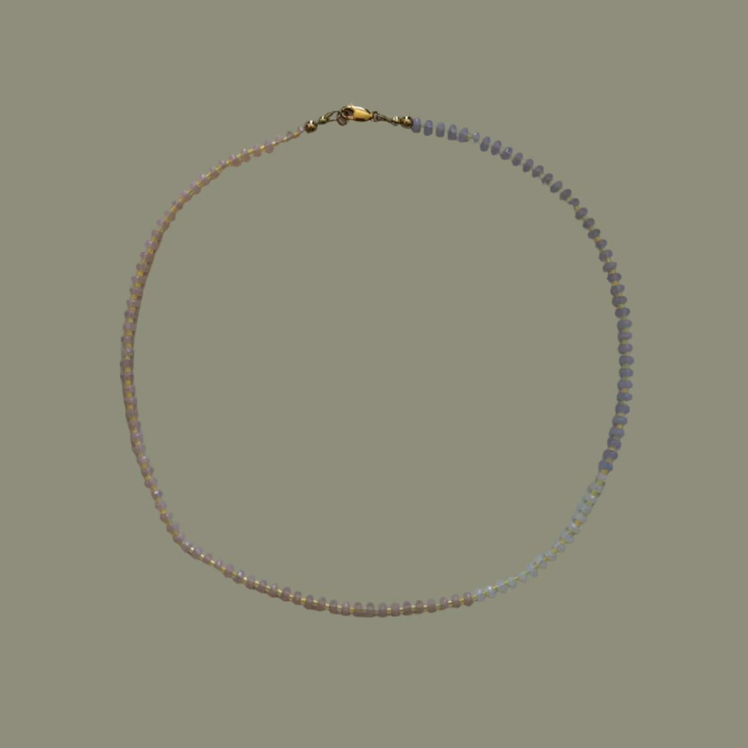 Necklace with small beads on a light background