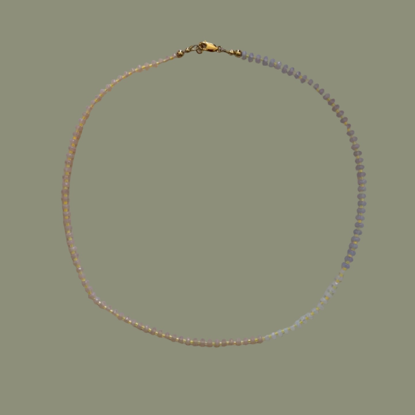 Necklace with small beads on a light background