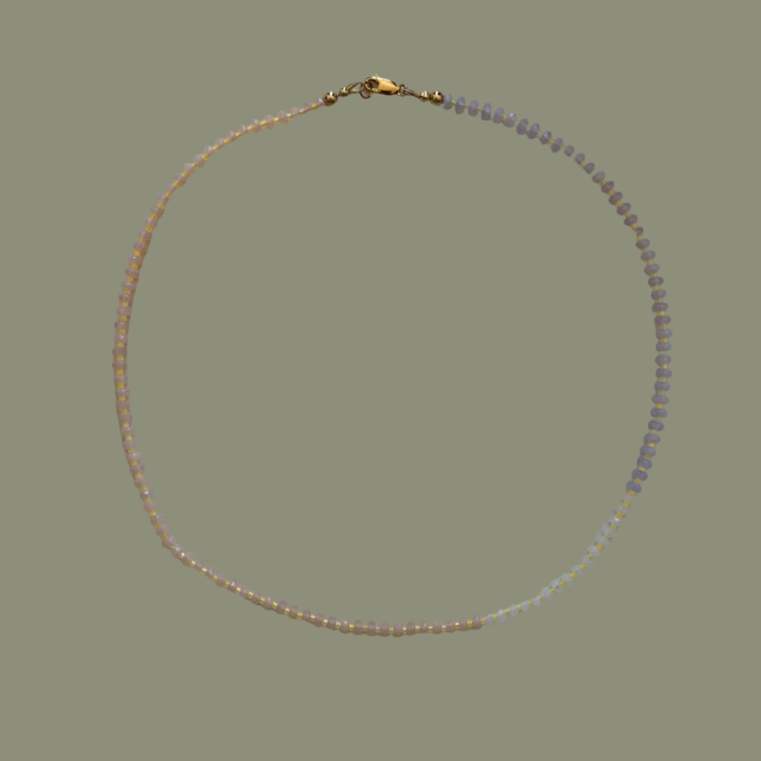 Necklace with small beads on a light background