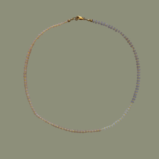 Necklace with small beads on a light background