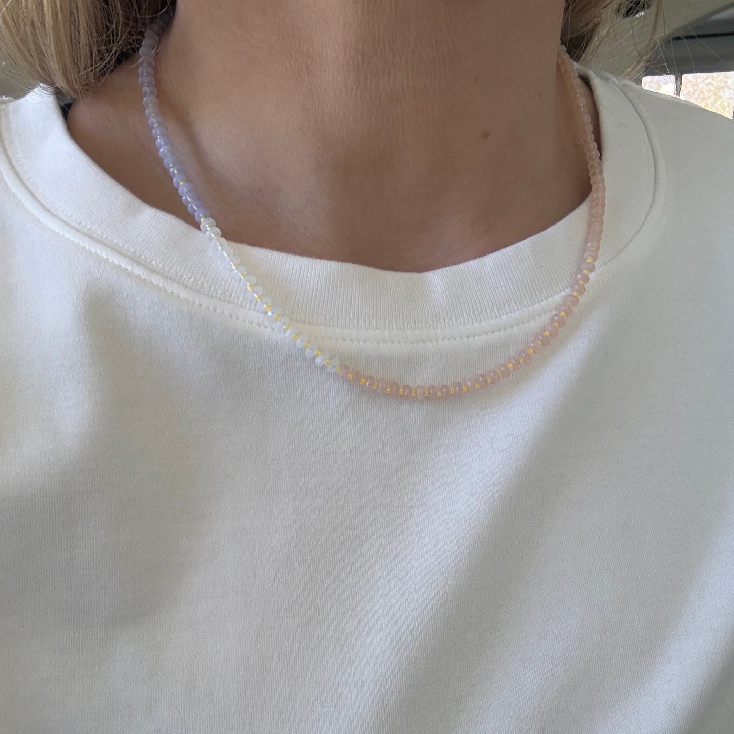 Close-up of a white garment with a visible label.