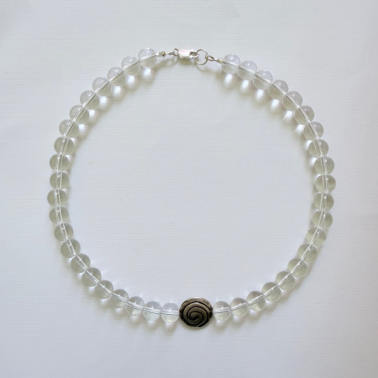 Necklace with clear beads on a white background