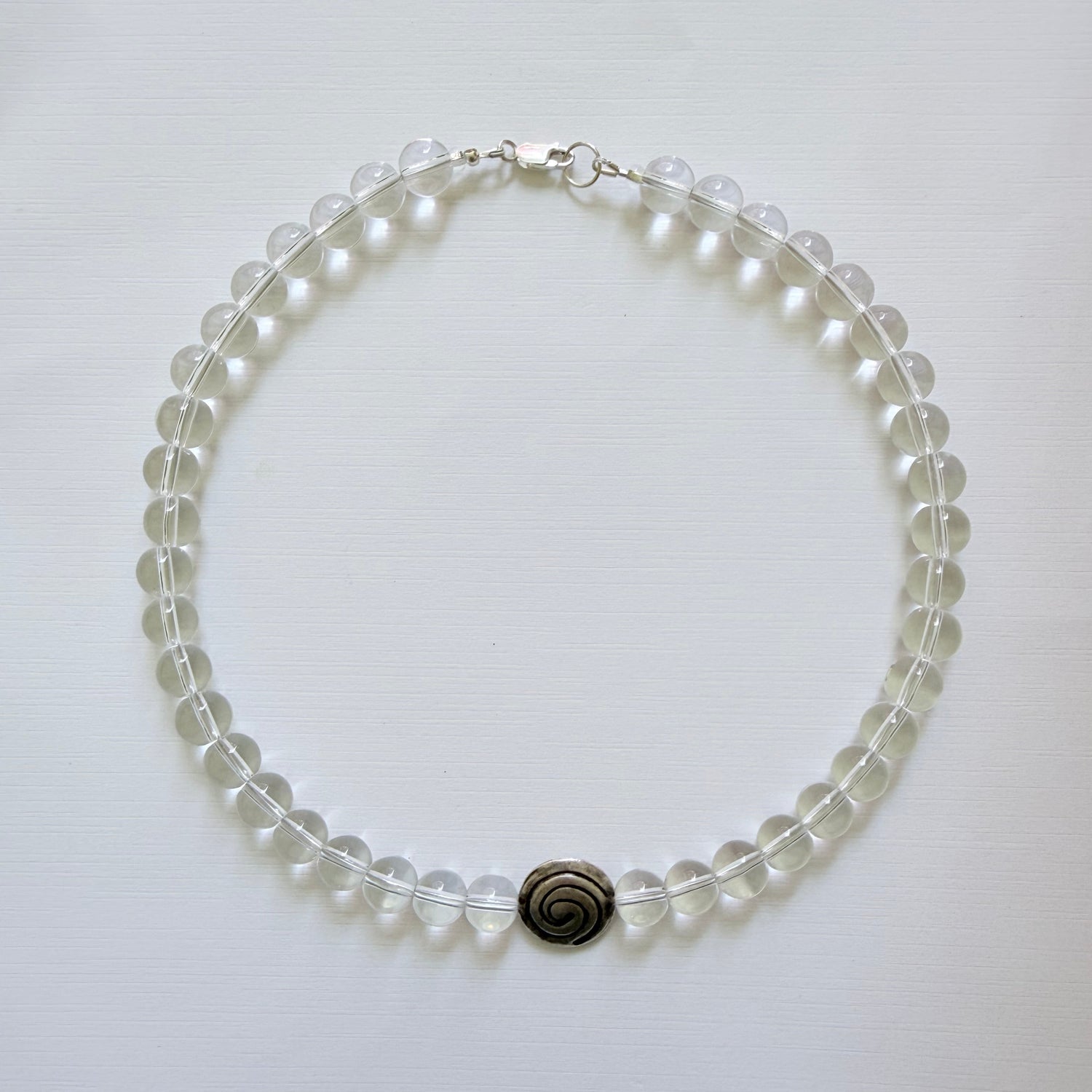 Necklace with clear beads on a white background