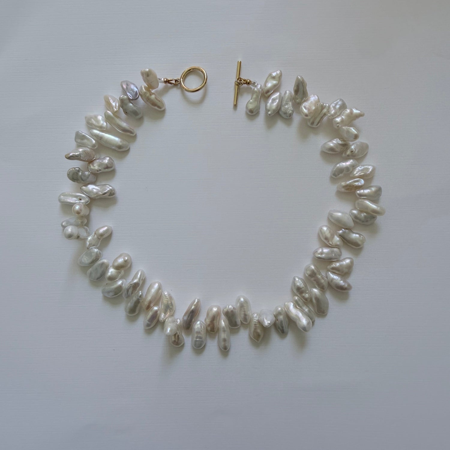 Pearl necklace on a white background