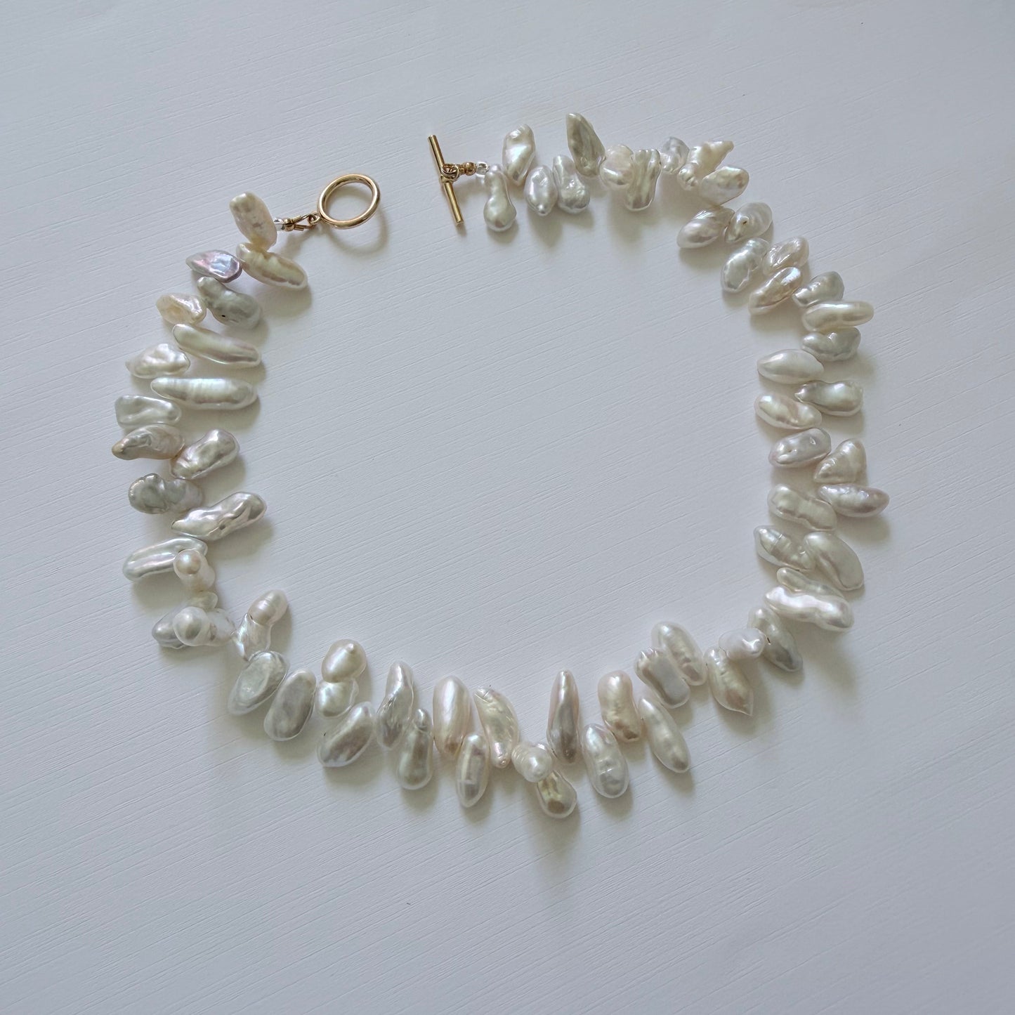 Pearl necklace on a white background