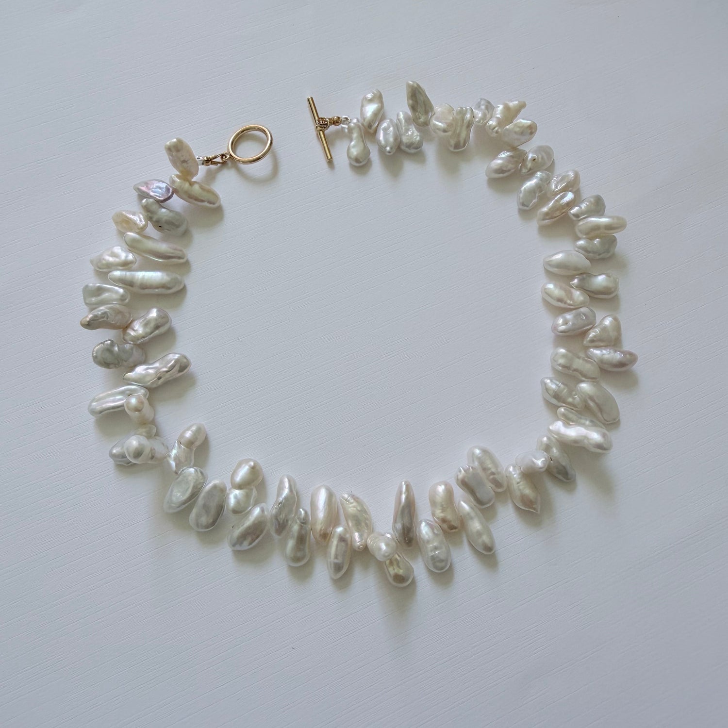Pearl necklace on a white background