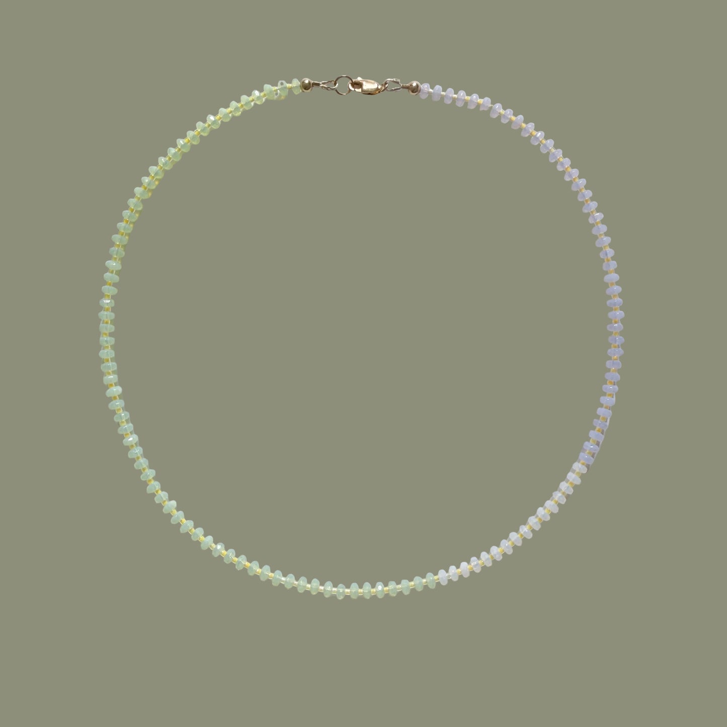 Pearl necklace on a light gray background