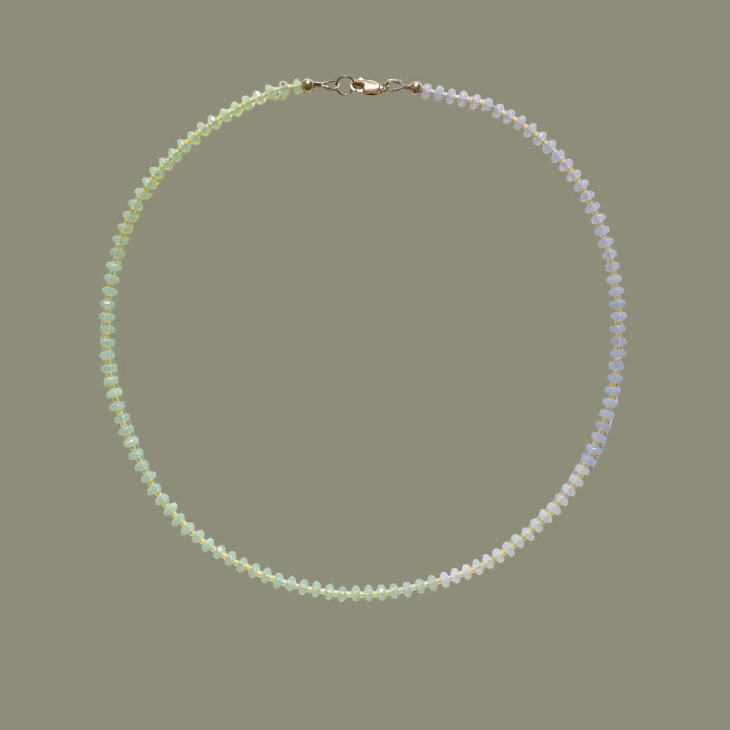 Pearl necklace on a light gray background