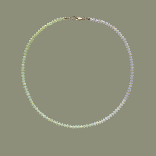 Pearl necklace on a light gray background