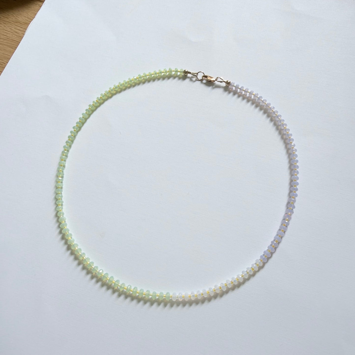 Pearl necklace on a white surface