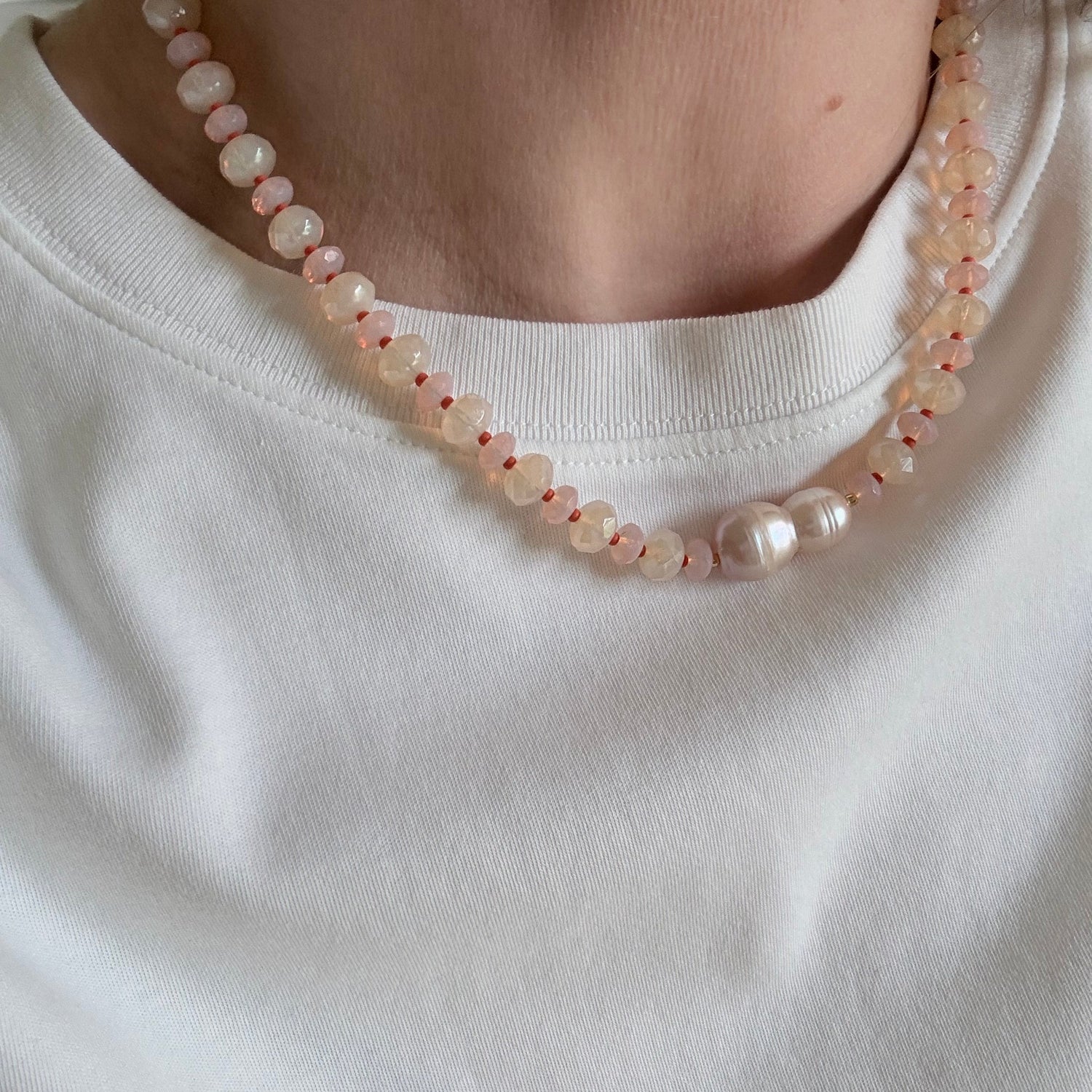 Close-up of a pearl necklace on a white background