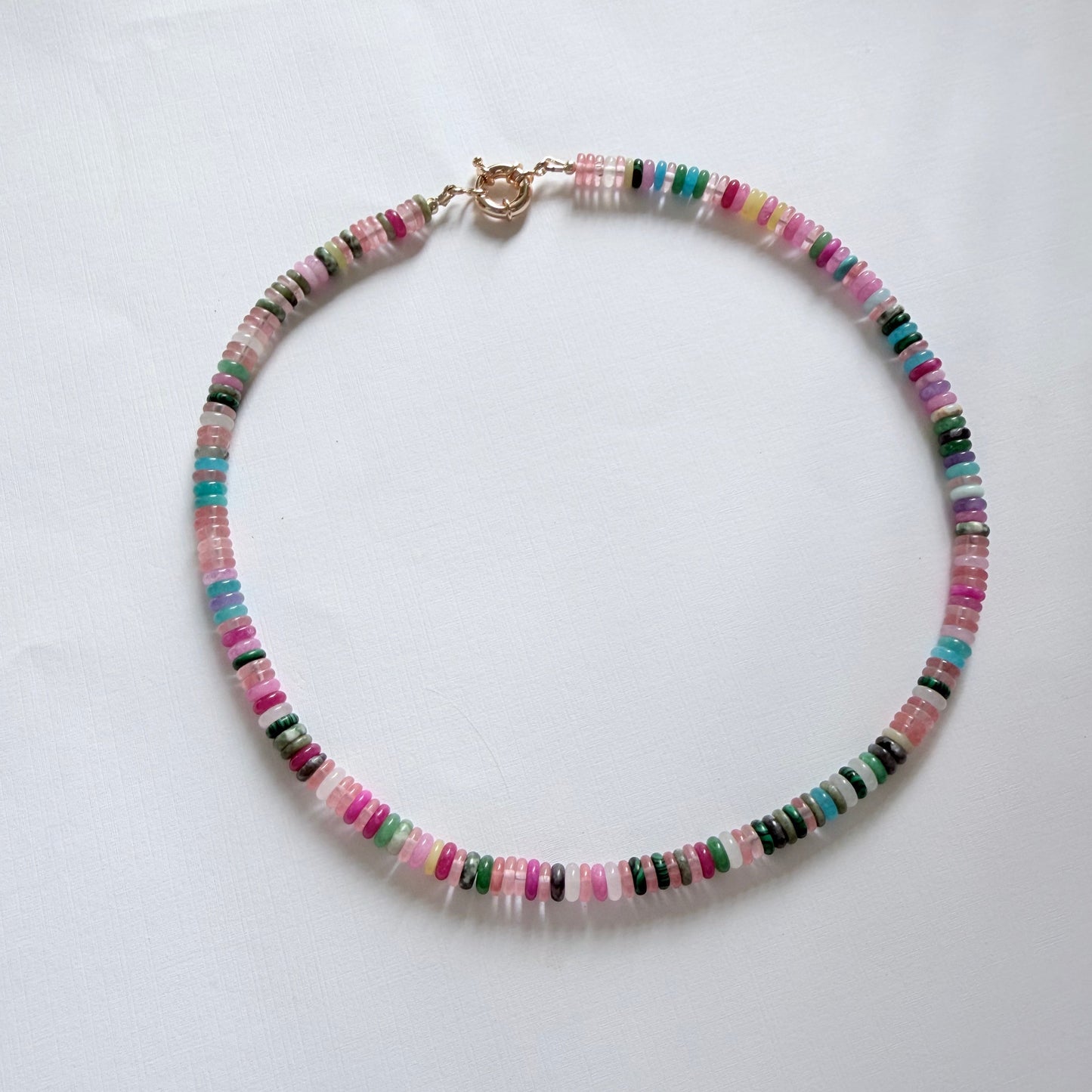 Multicolored beaded necklace on a white background