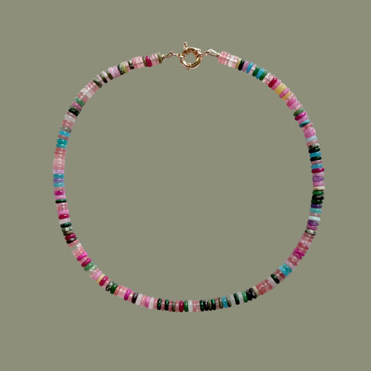 Multicolored beaded necklace on a white background