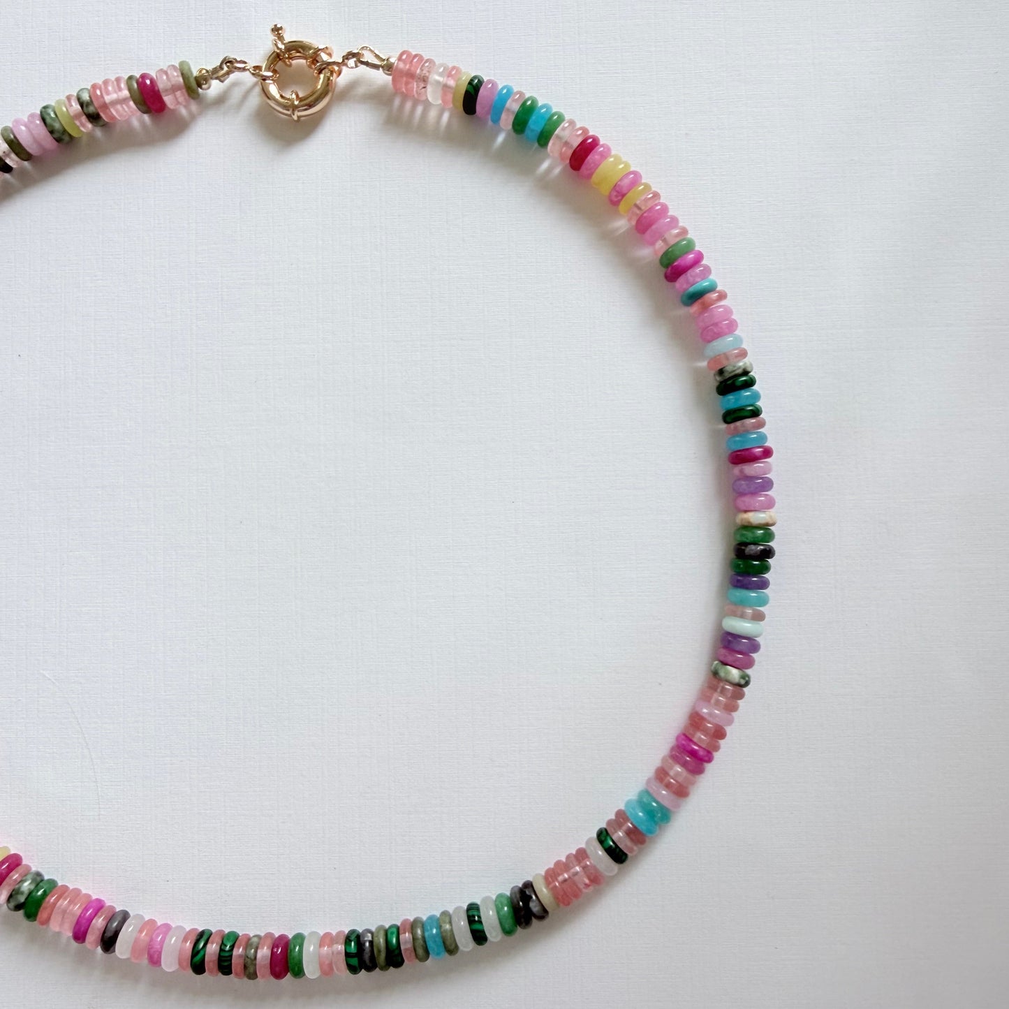 Multicolored beaded necklace on a white background