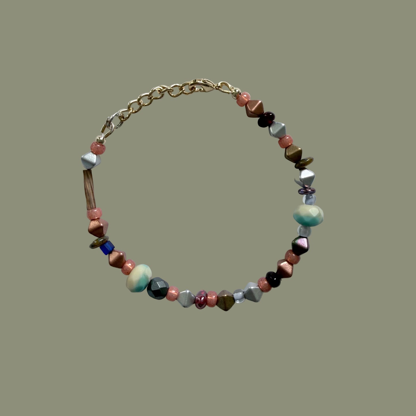 Multicolored beaded bracelet on a light gray background
