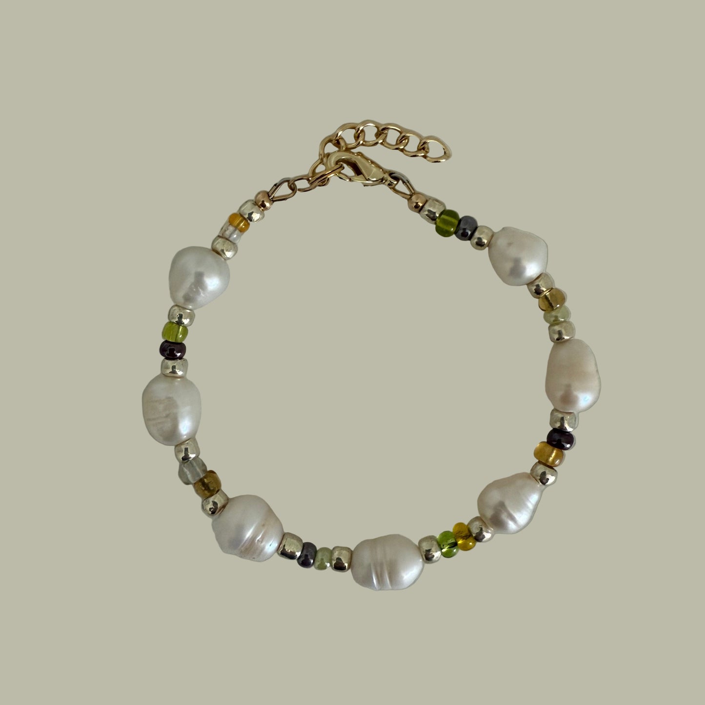 A bracelet with freshwater pearls, Japanese seed beads, and a gold-filled closure.