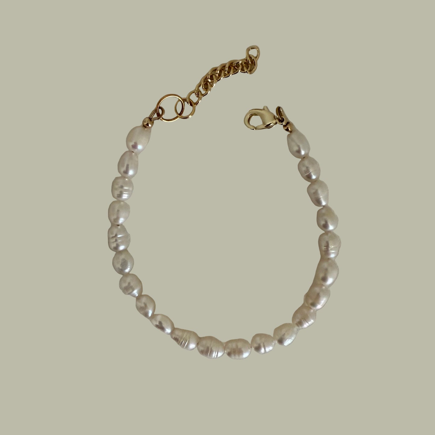A bracelet with white freshwater pearls and a gold-filled closure.