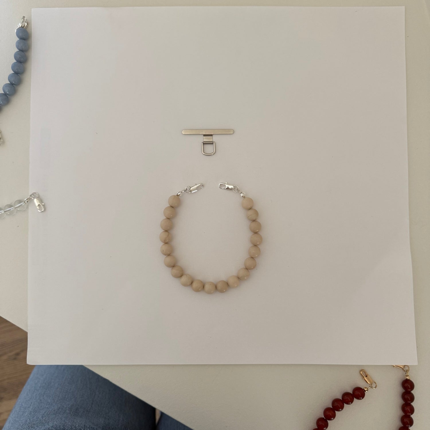 beaded fossil jasper phone chain on a white background