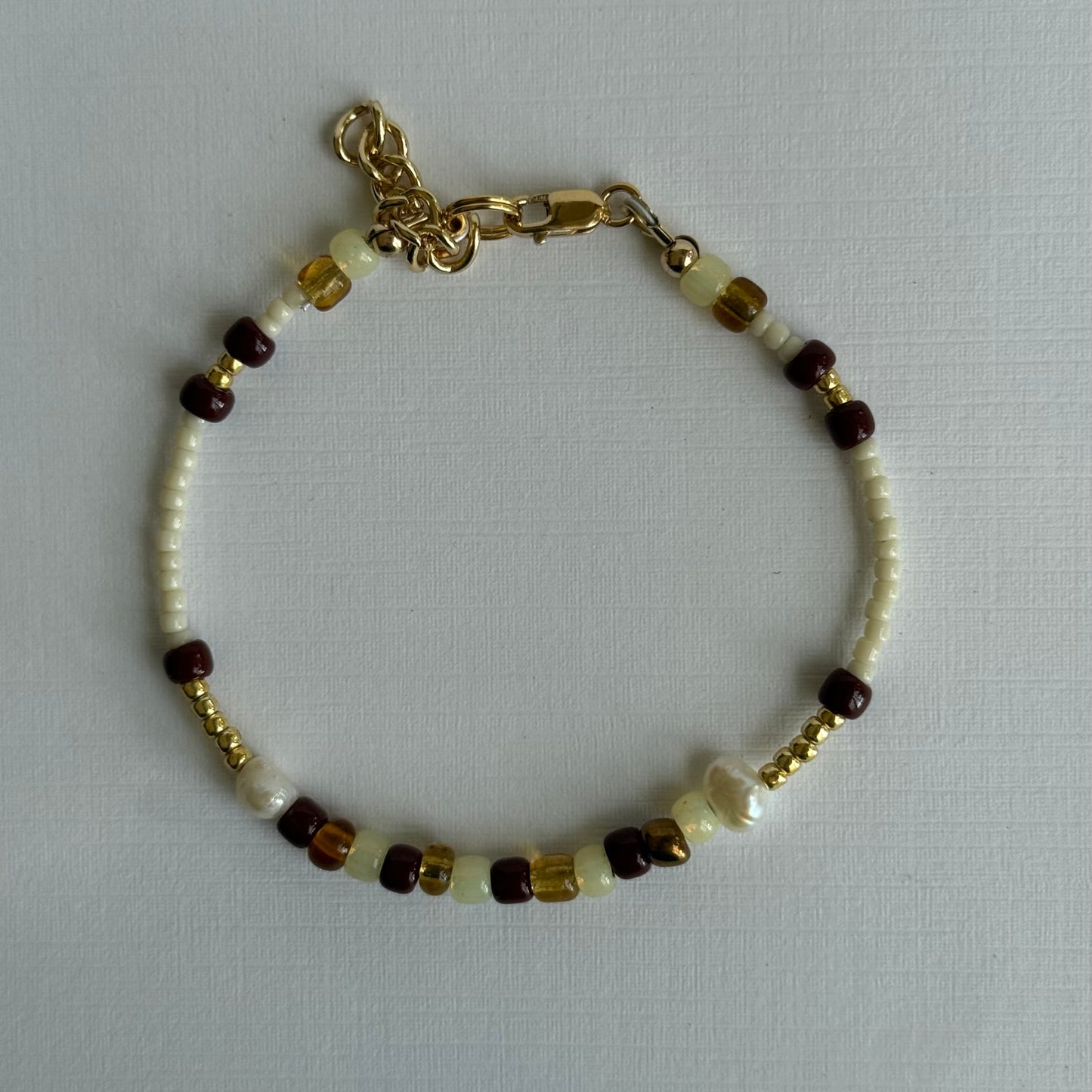 Bracelet with beads on a light gray background