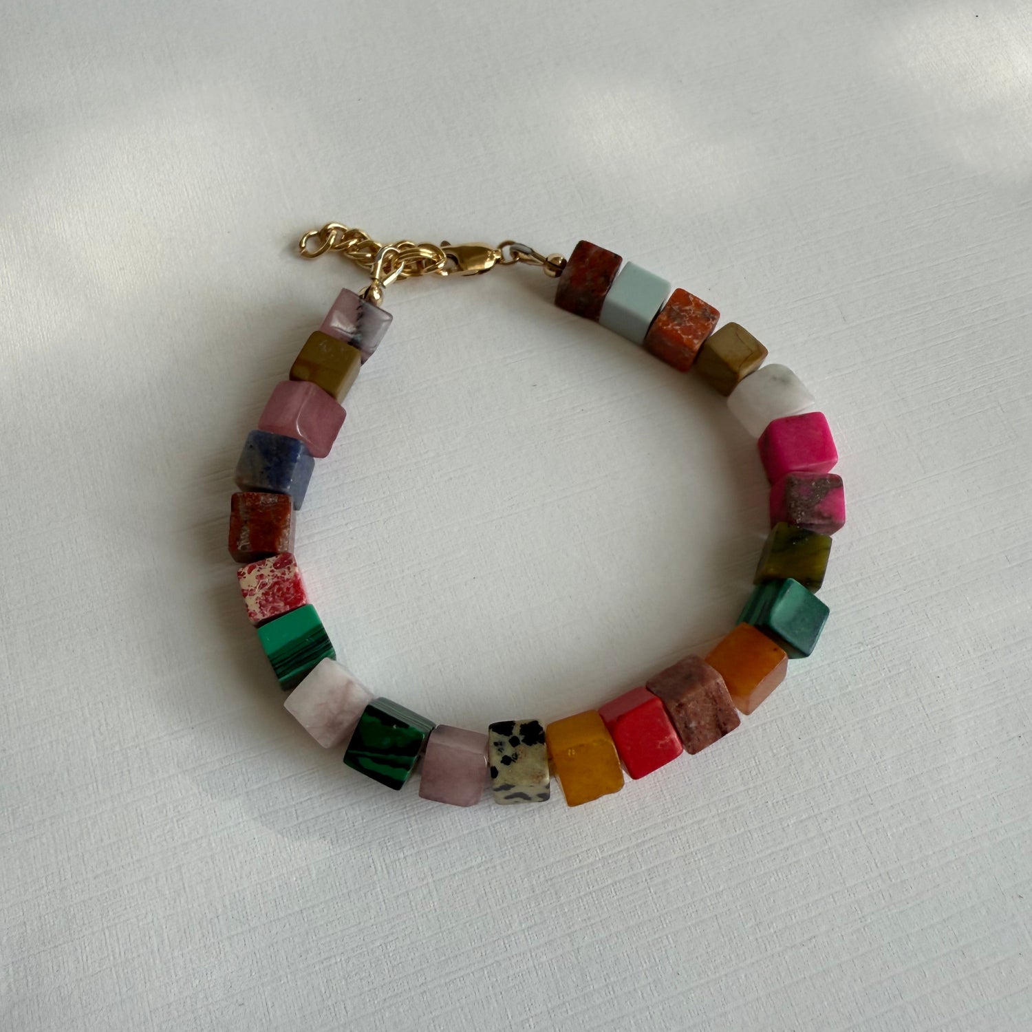 Multicolored beaded bracelet on a white background