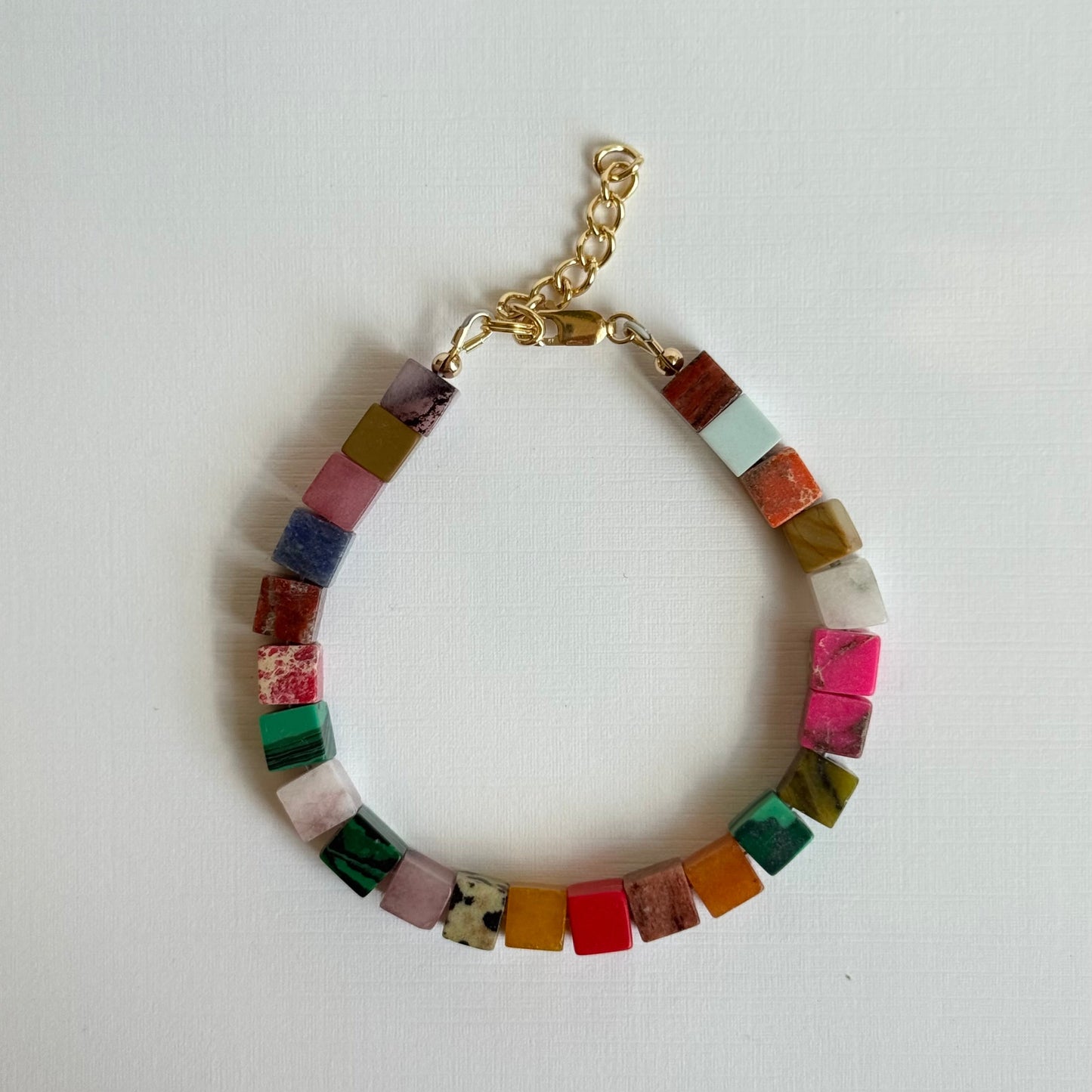Multicolored beaded bracelet on a white background