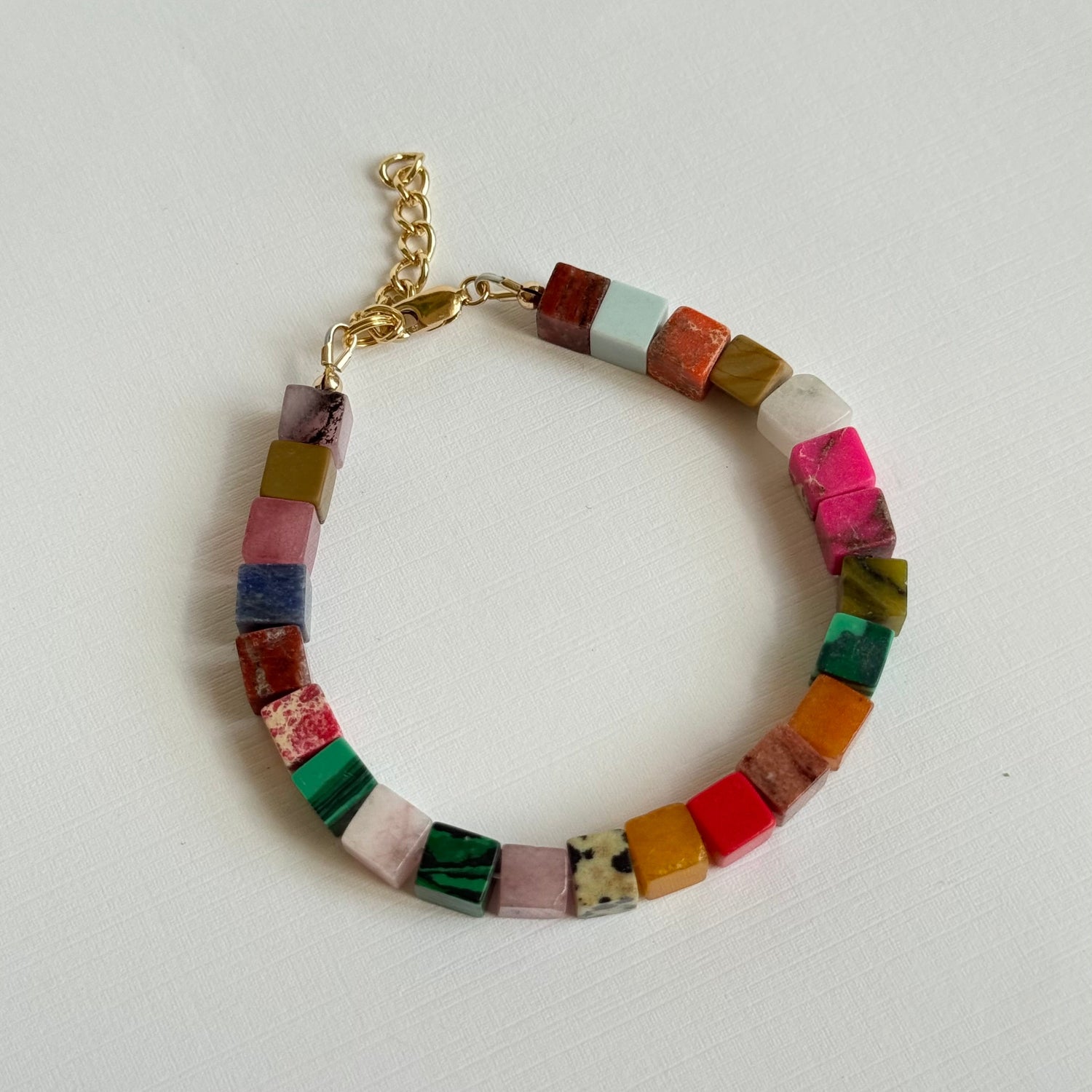 Multicolored beaded bracelet on a white background